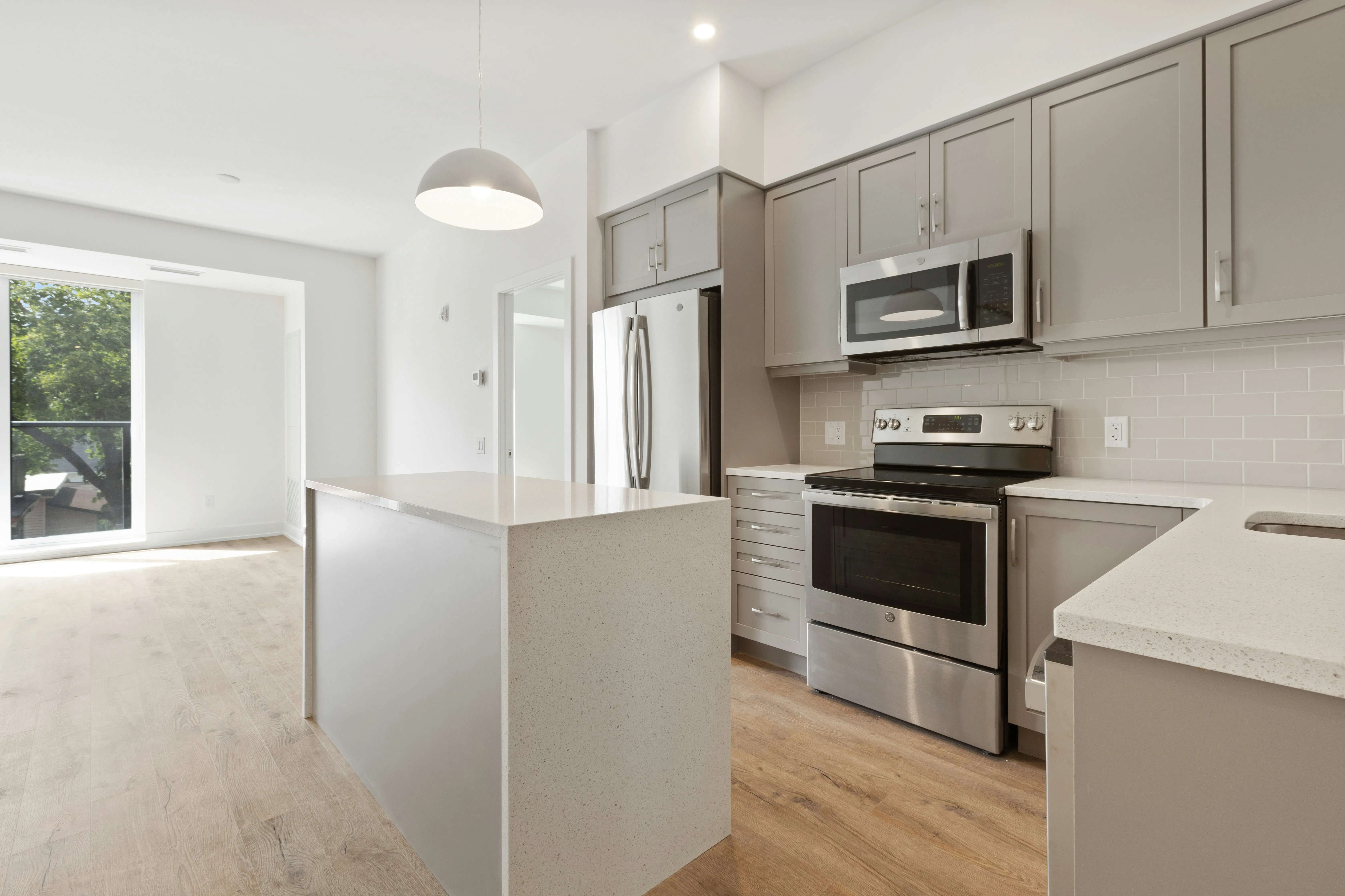 Bright, modern apartment kitchen and living area